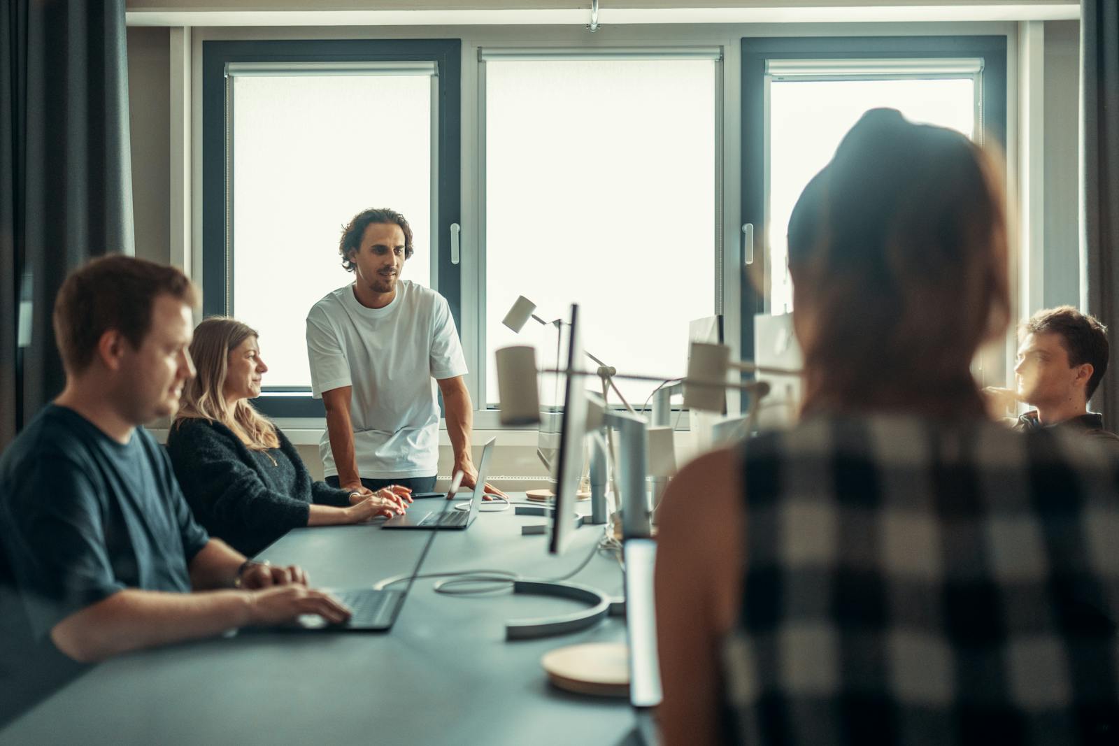 The Atlas Consultants Group team collaborating in a modern office